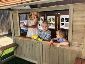 Kids playing in playhouse